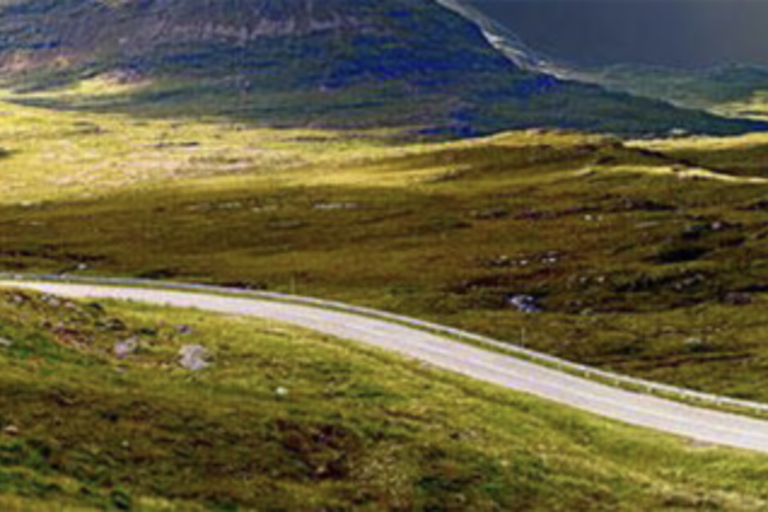Grow Your Journey banner image: a road through green, rolling hills