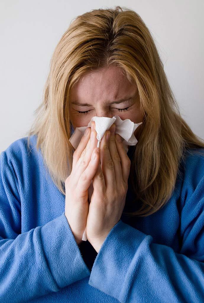 Sick Woman Blows Nose