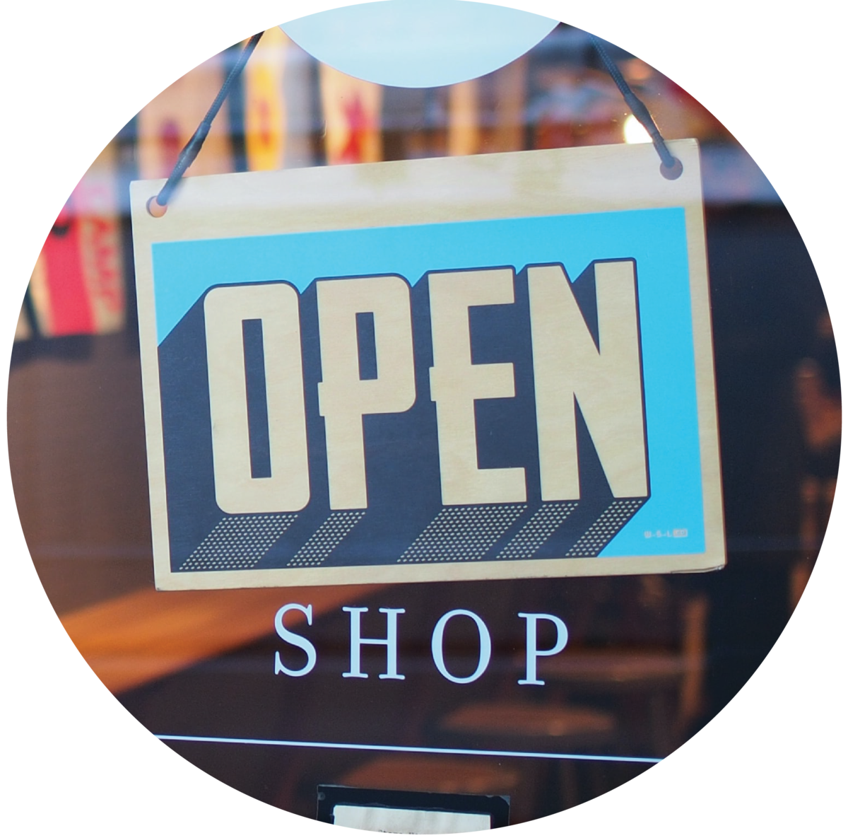 Sign on a window that reads "Open" above text on the window that reads "shop"