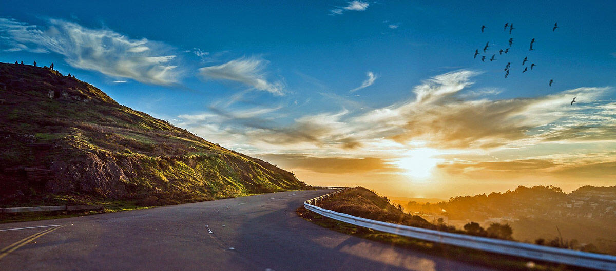 Winding road into a sunrise